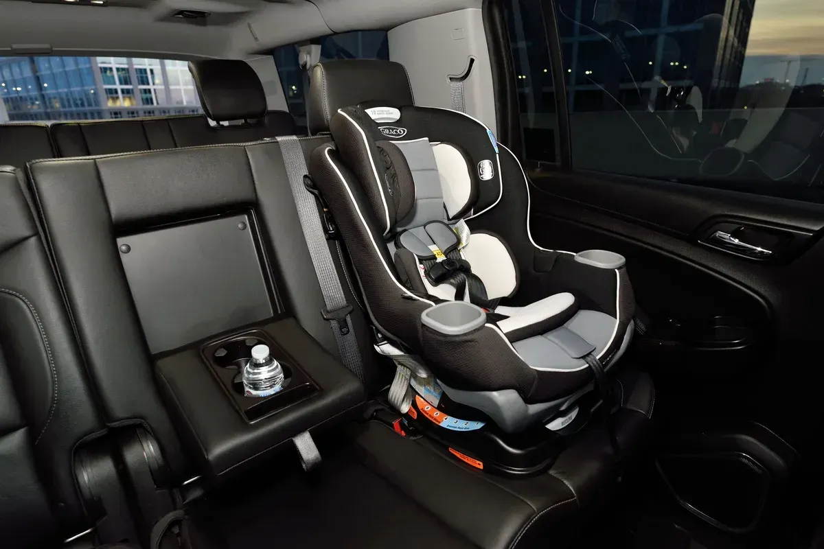 A child seat fitted in the back of a car
