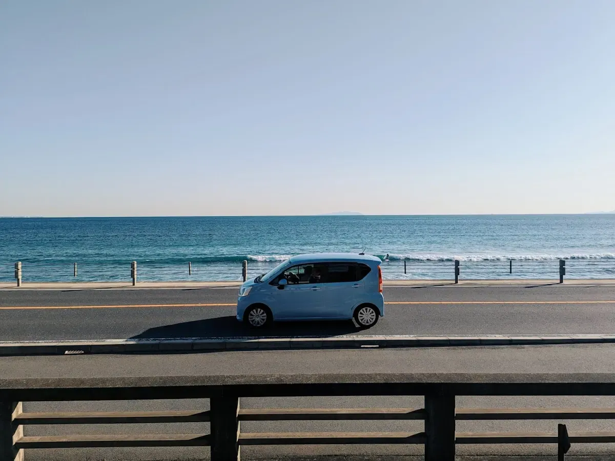A car driving a coastal road